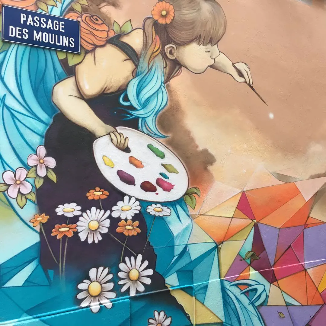 Street art on the Passage des Moulins: a girl painting flowers, with a palette in her hand