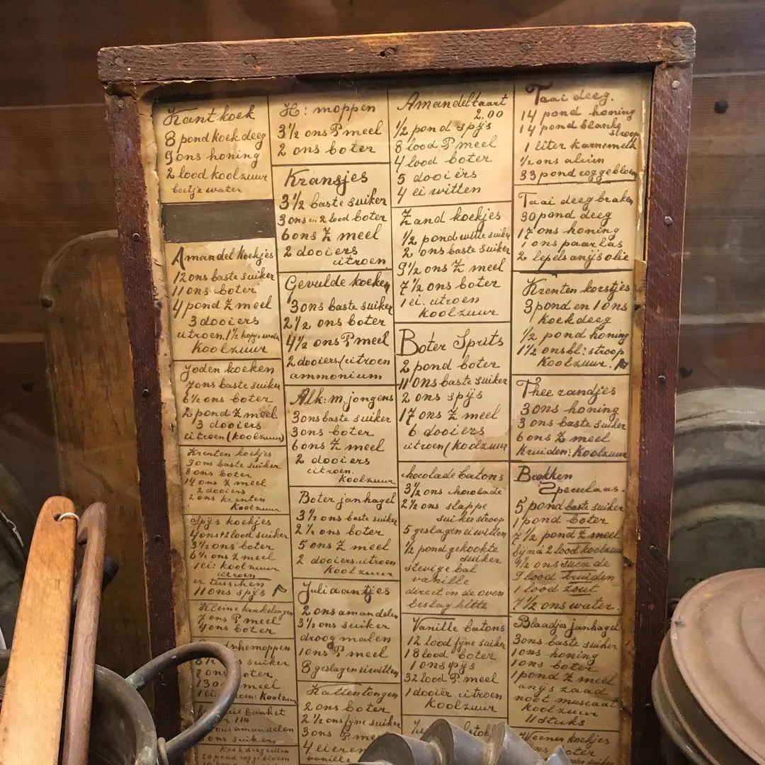 A framed board of old handwritten recipes, in Zaanse Schans