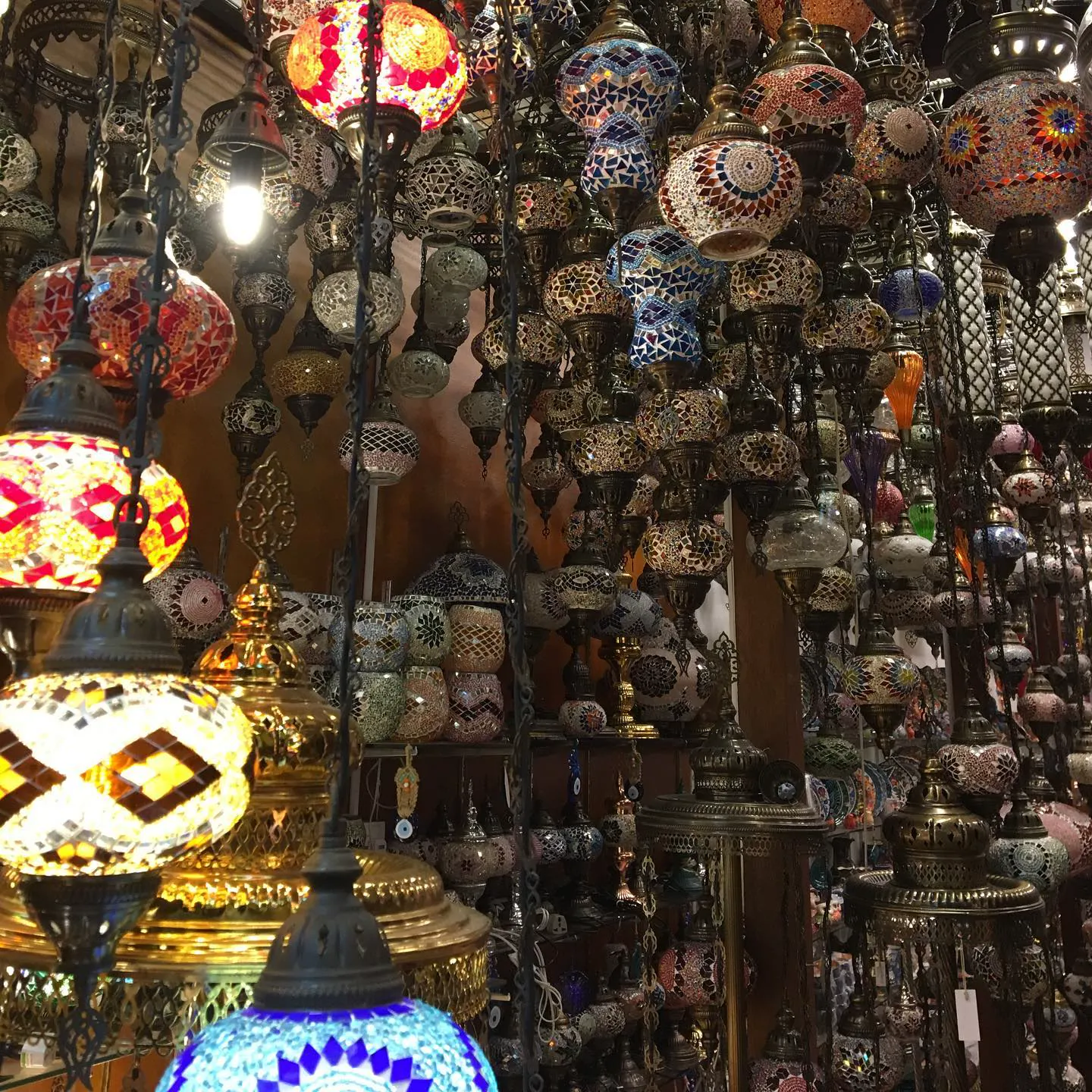 Hundreds of colourful mosaic glass lamps hanging in a shop on Arab Street