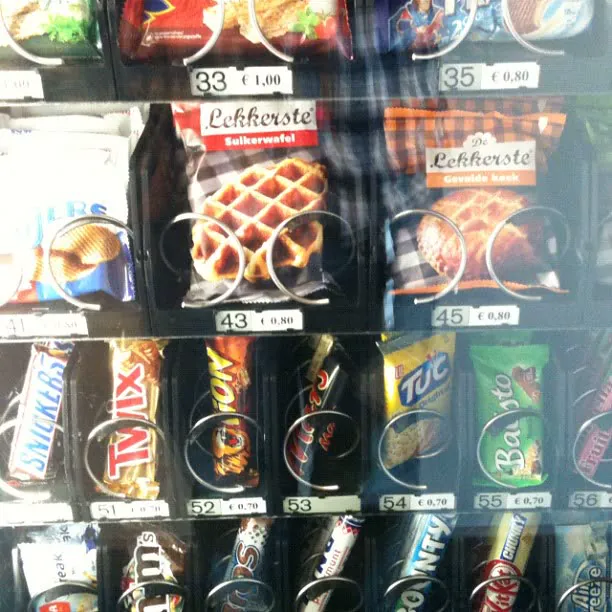 A vending machine full of stroopwafels, chocolate bars and snacks